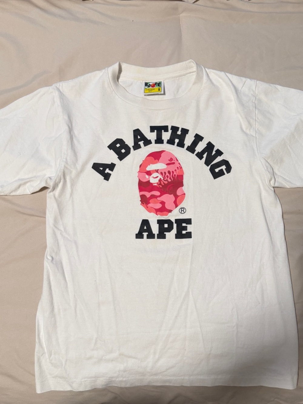 A Bathing Ape White Short-Sleeve Logo Tee with Pink Camo Ape Head